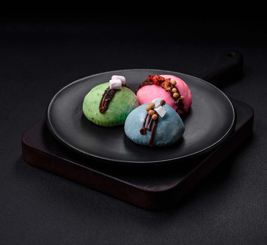 delicious sweet colorful mochi desserts ice cream with rice dough toppings dark concrete background copy