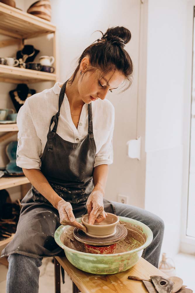 woman craftmaster pottery shop